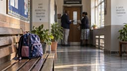 AI-generated symbolic school-safeguarding scene with an empty backpack and anonymous adult professionals